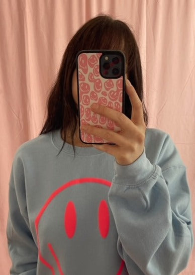 drippy smiley iPhone case